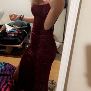 maroon dress size small length wise is long with a slit on the side